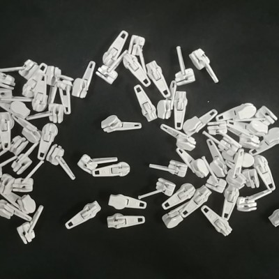 WHITE metal slidders for zipper tape